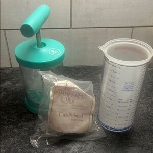 Pampered Chef bundle. Whipped cream maker, Cut N Seal and Measure All Cup